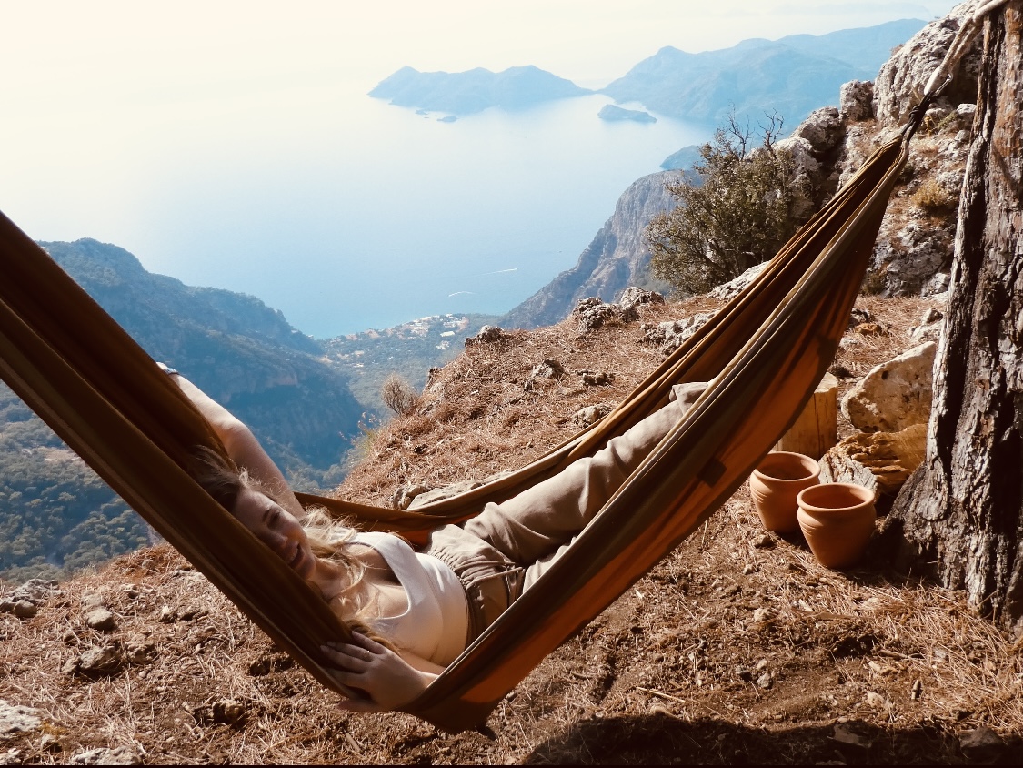 Resting in nature with sea and mountains in the distance